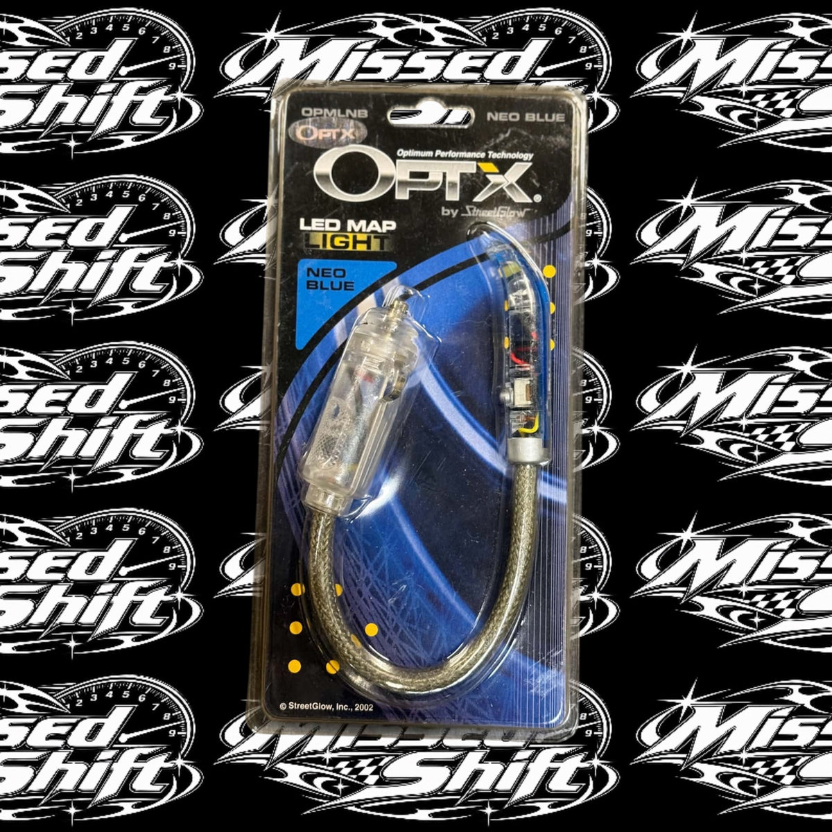 Front of OPTX by StreetGlow Neo Blue LED map light package on repeating Missed Shift logo background