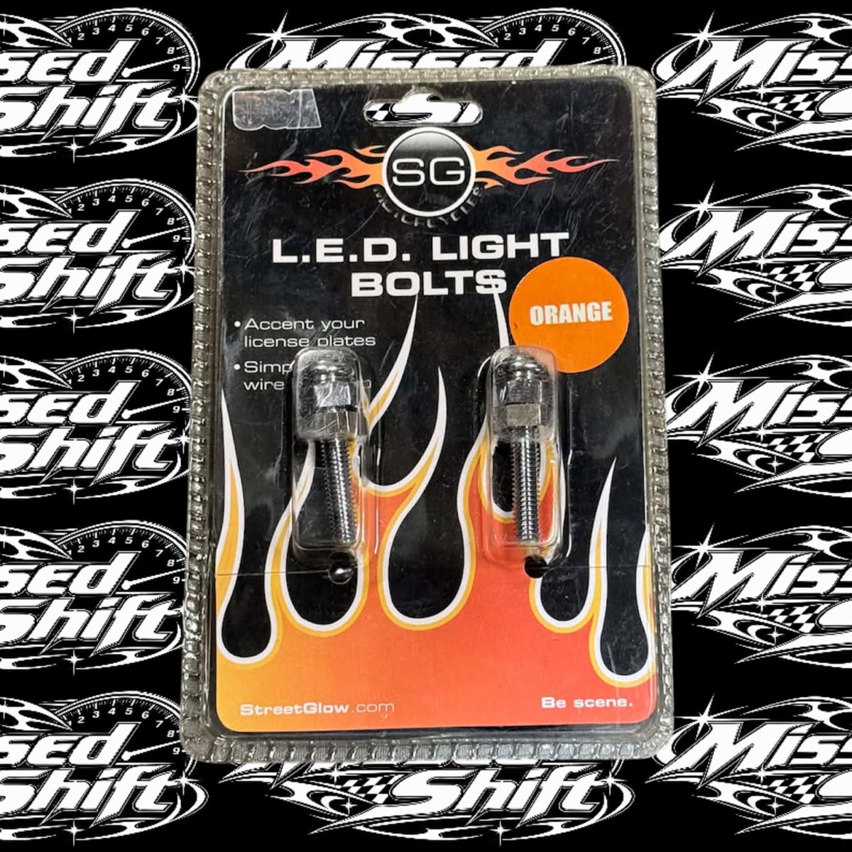 Streetglow orange LED light bolts in original package on Missed Shift logo background